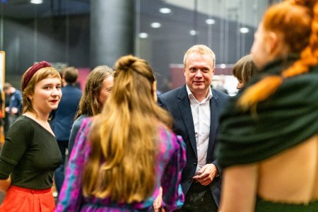 Michał Bolesławski, Chairman of the Foundation Council during the opening of the exhibition "The Spirit Of Nature And Other Fairy Tales", Katowice, 2019, (on the left) Magdalena Gajdzica performer